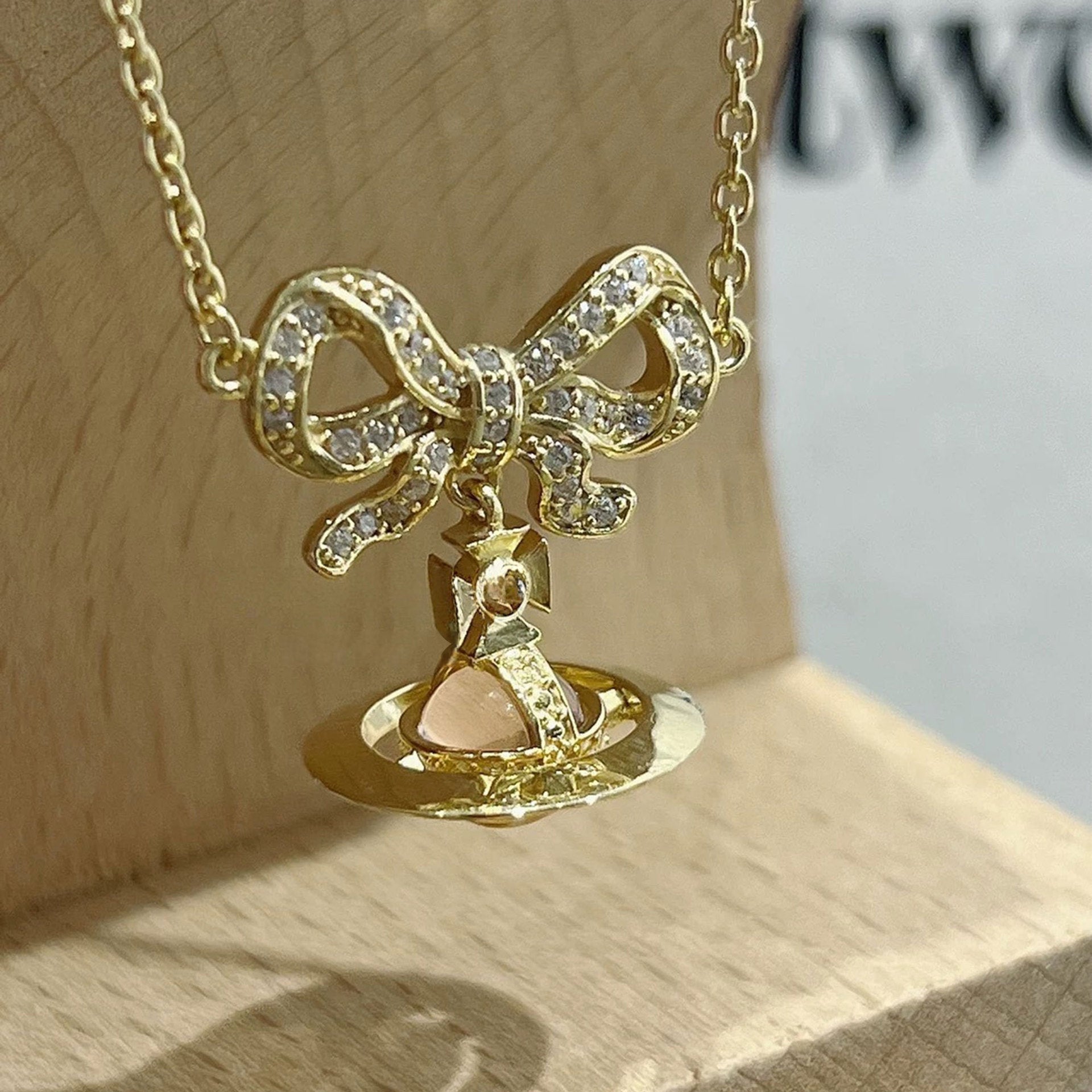 Sweet Luxury Bow Saturn Cat Eye Clavicle Necklace Ladies Daily Pendant Chain